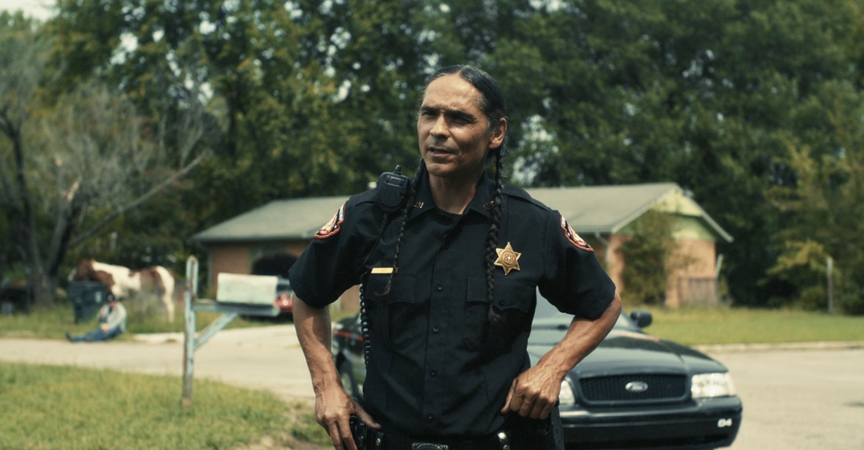 Reservation Dogs Cast - Zahn McClarnon as Officer Big