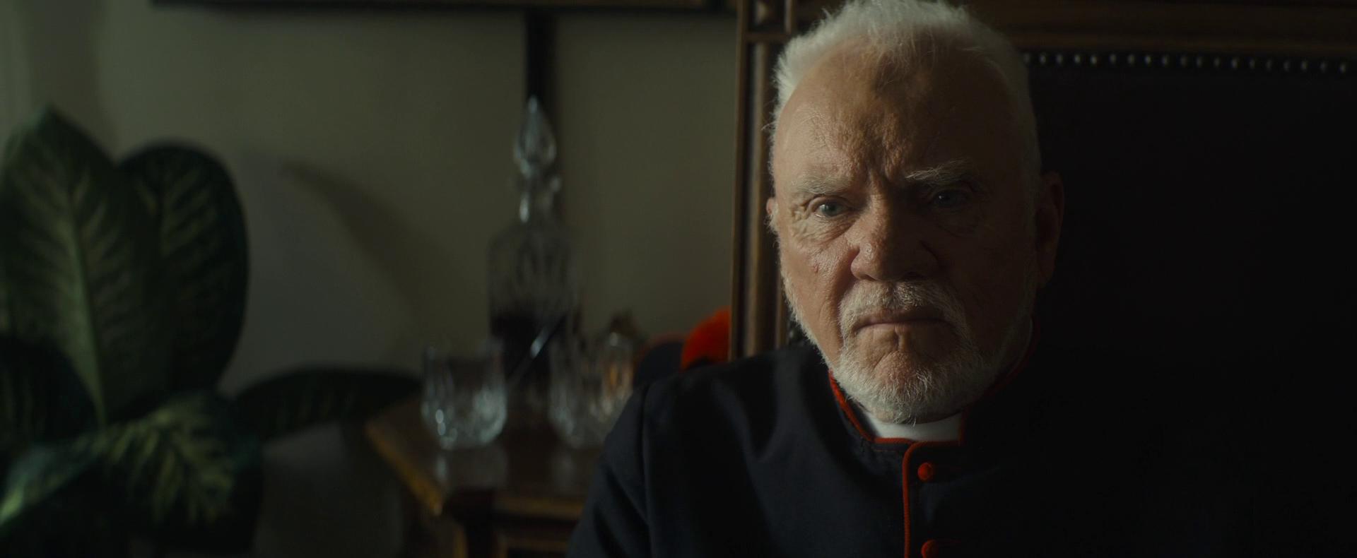 Father Stu Cast on Netflix - Malcolm McDowell as Monsignor Kelly